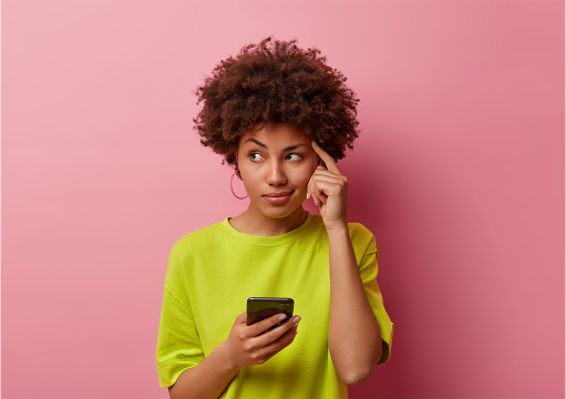 pensive-dark-skinned-woman-keeps-finger-temple-looks-aside-thoughtfully-uses-new-gadget-first-time-dressed-casually-tries-remember-name-product-before-browsing-internet-has-idea-edited 1